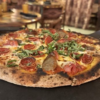 Lena’s Wood-Fired Pizza & Tap signature dishes Neapolitan-style PizzasSpicy Meatball PaniniChicken Parmigiana
